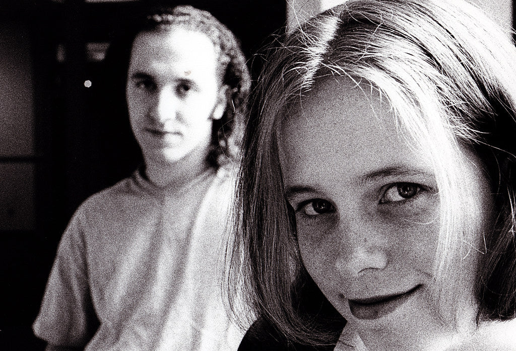 Two people with a focus on one person in the foreground.