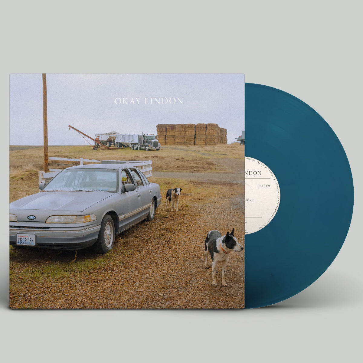 Vinyl record with a cover showing a car and dogs on a farm, labeled 'Okay Lindon'.