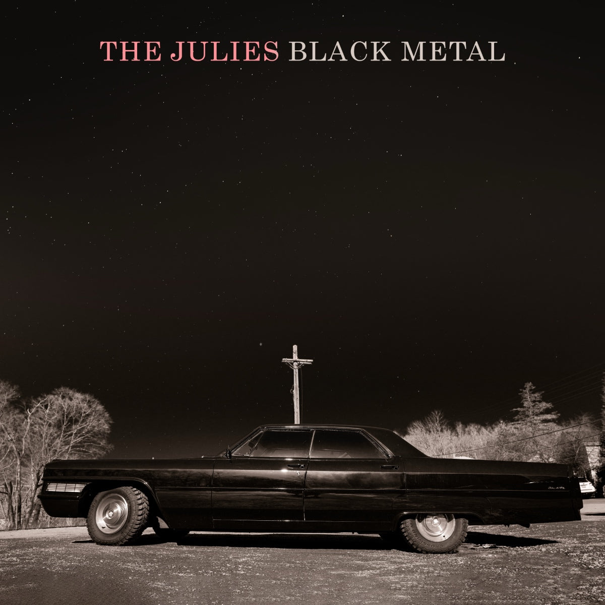 Album cover with a black car and cross against a dark sky, featuring 'The Julies Black Metal' text.