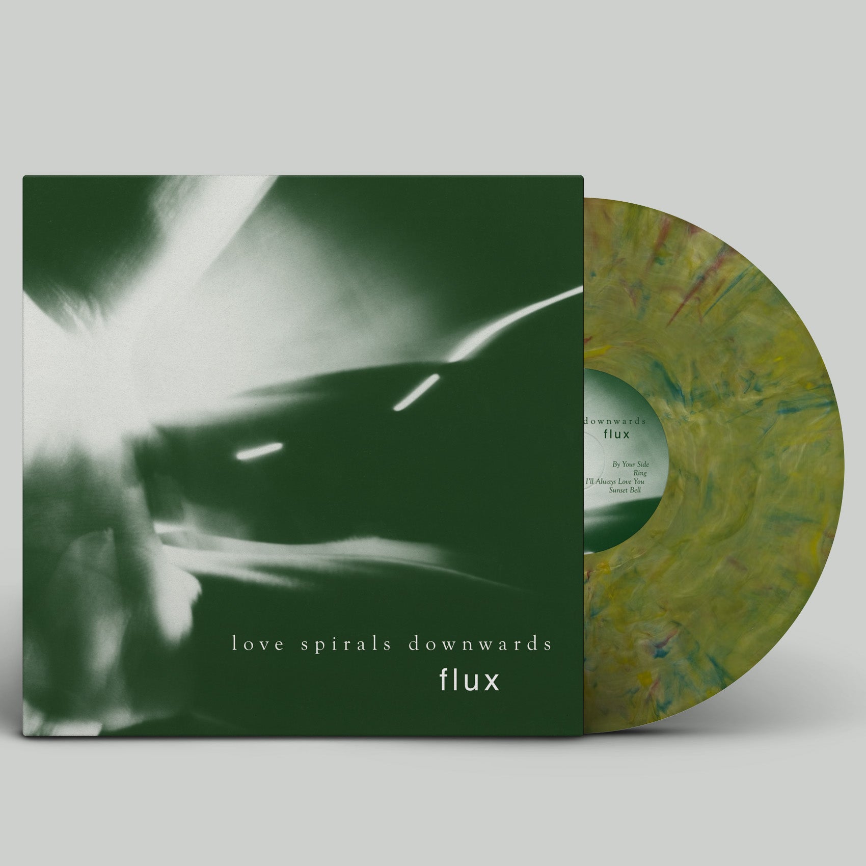 Vinyl record with a green and yellow marbled design and a black and white album cover on a light gray background.