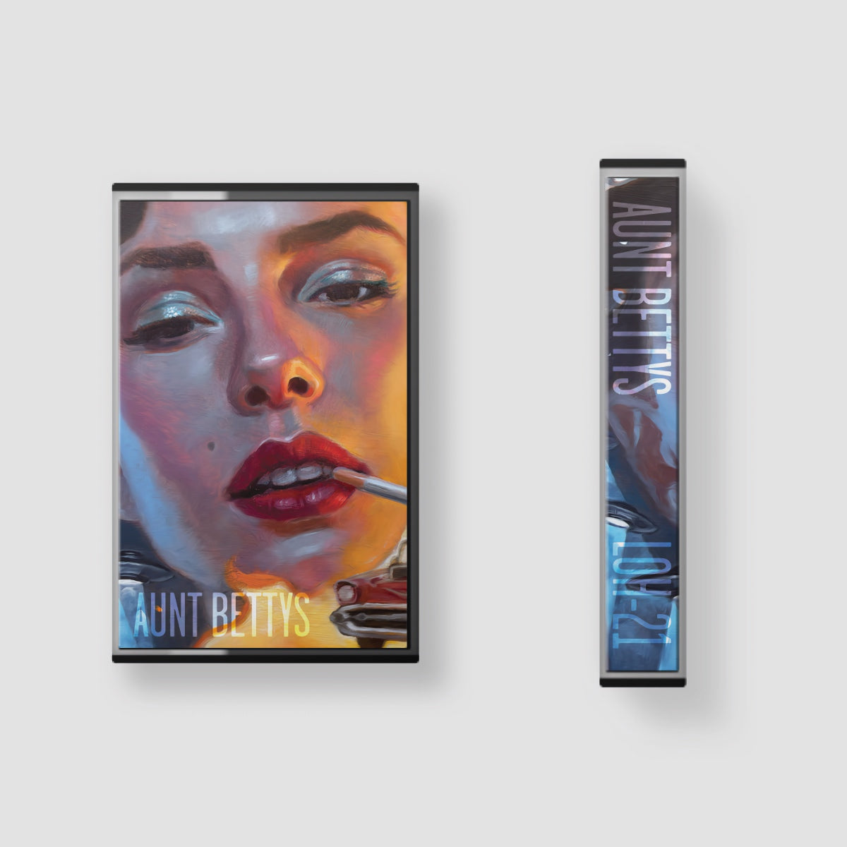 Cassette tape cover of a woman's face with 'Aunt Betty's' branding on a white background