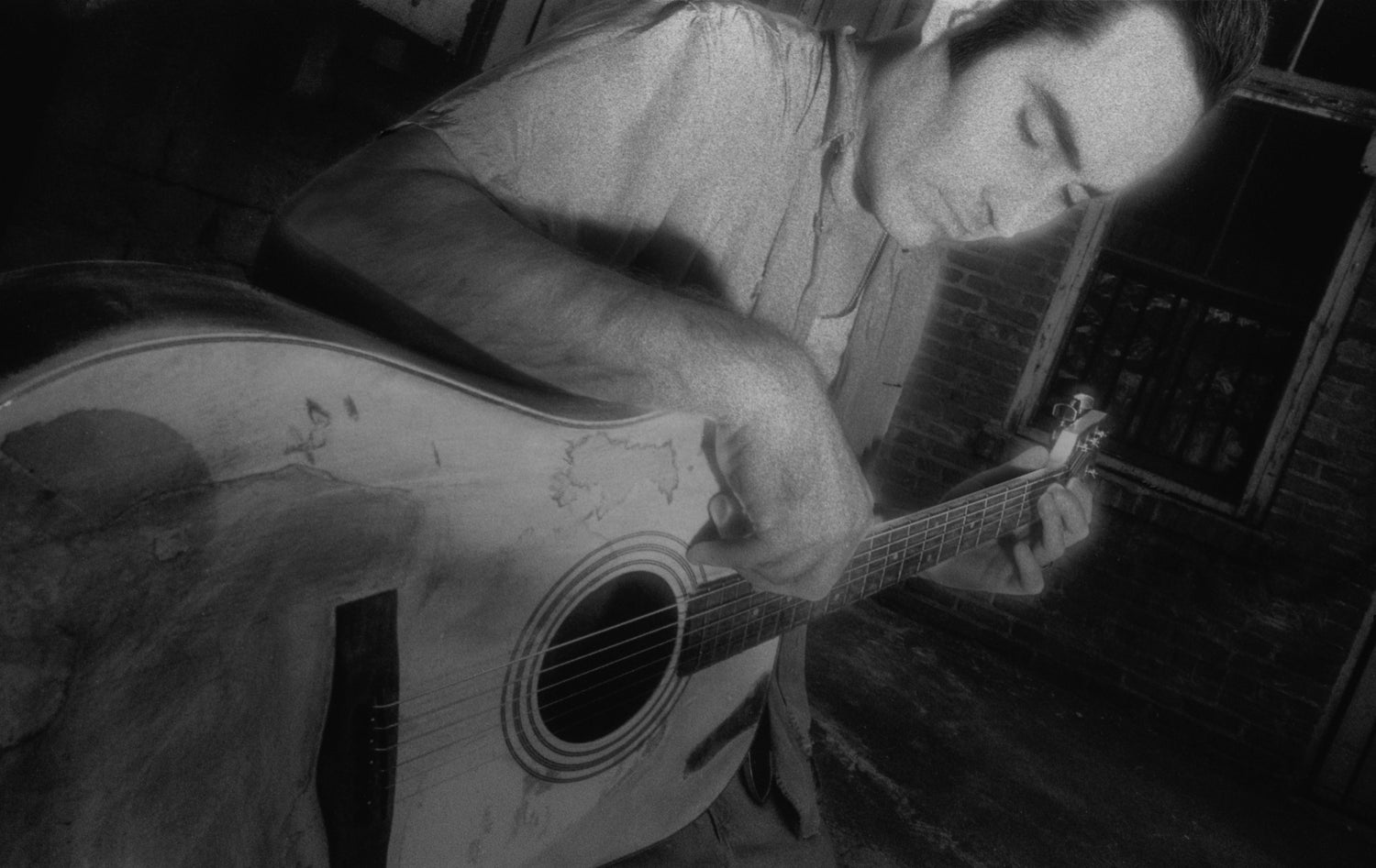 photo of Michael Knott playing acoustic guitar